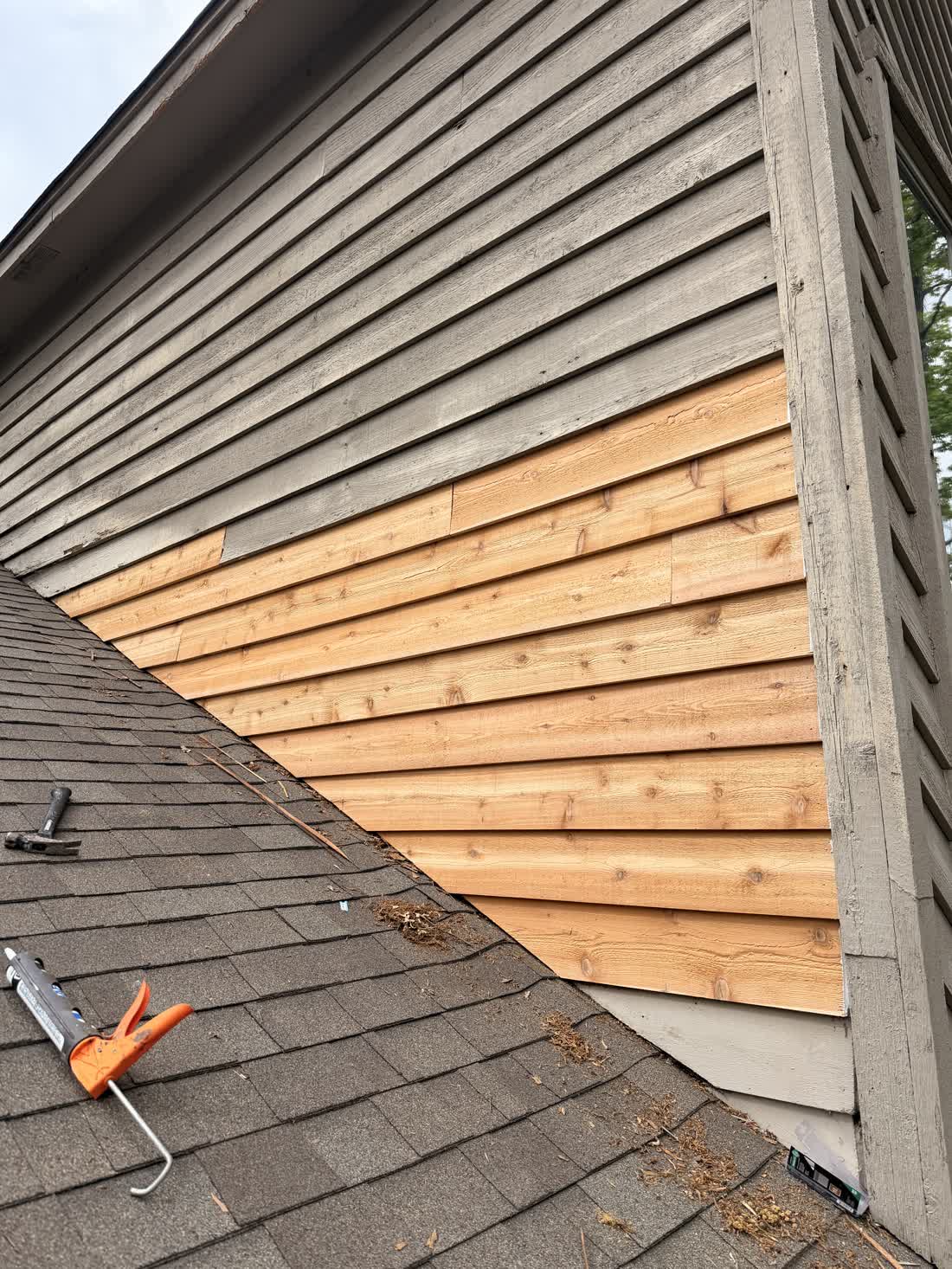Soffit and trim detail being inspected on a Mississippi home exterior