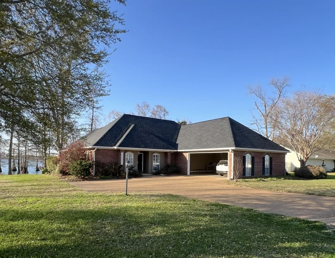 Lakeside Mississippi home with newly remodeled roof, siding, and exterior trim