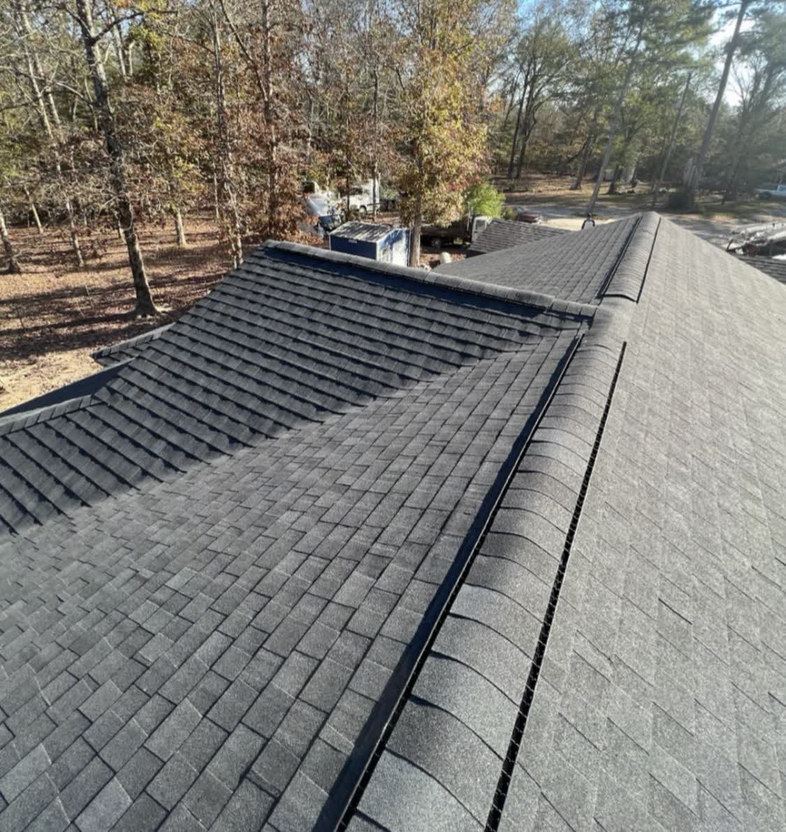 Close-up of crisp ridge cap on a finished asphalt shingle roof in Mississippi